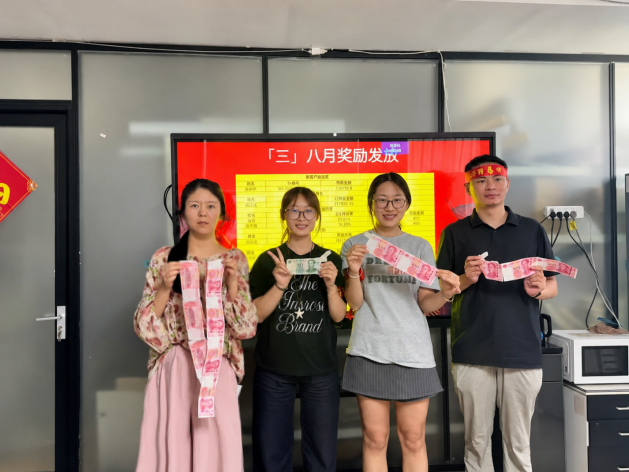Team members receiving performance rewards