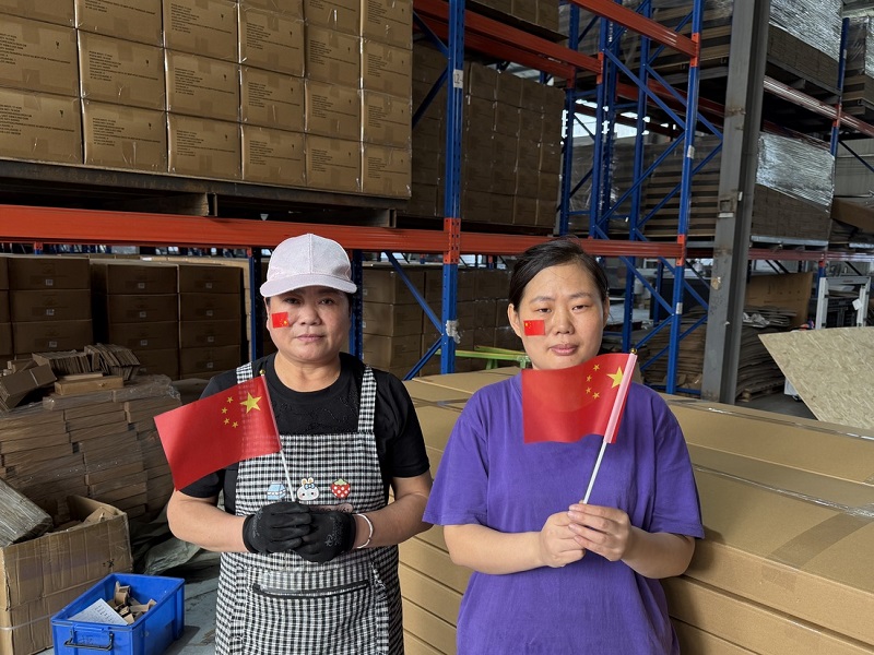 Factory colleagues celebrate together.