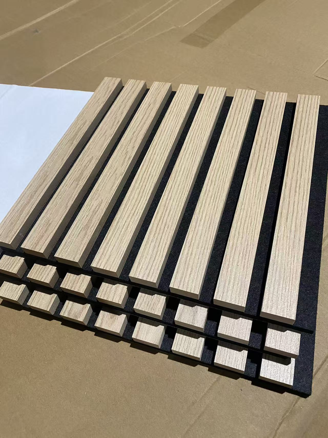 Wood-look slats on dark felt backing