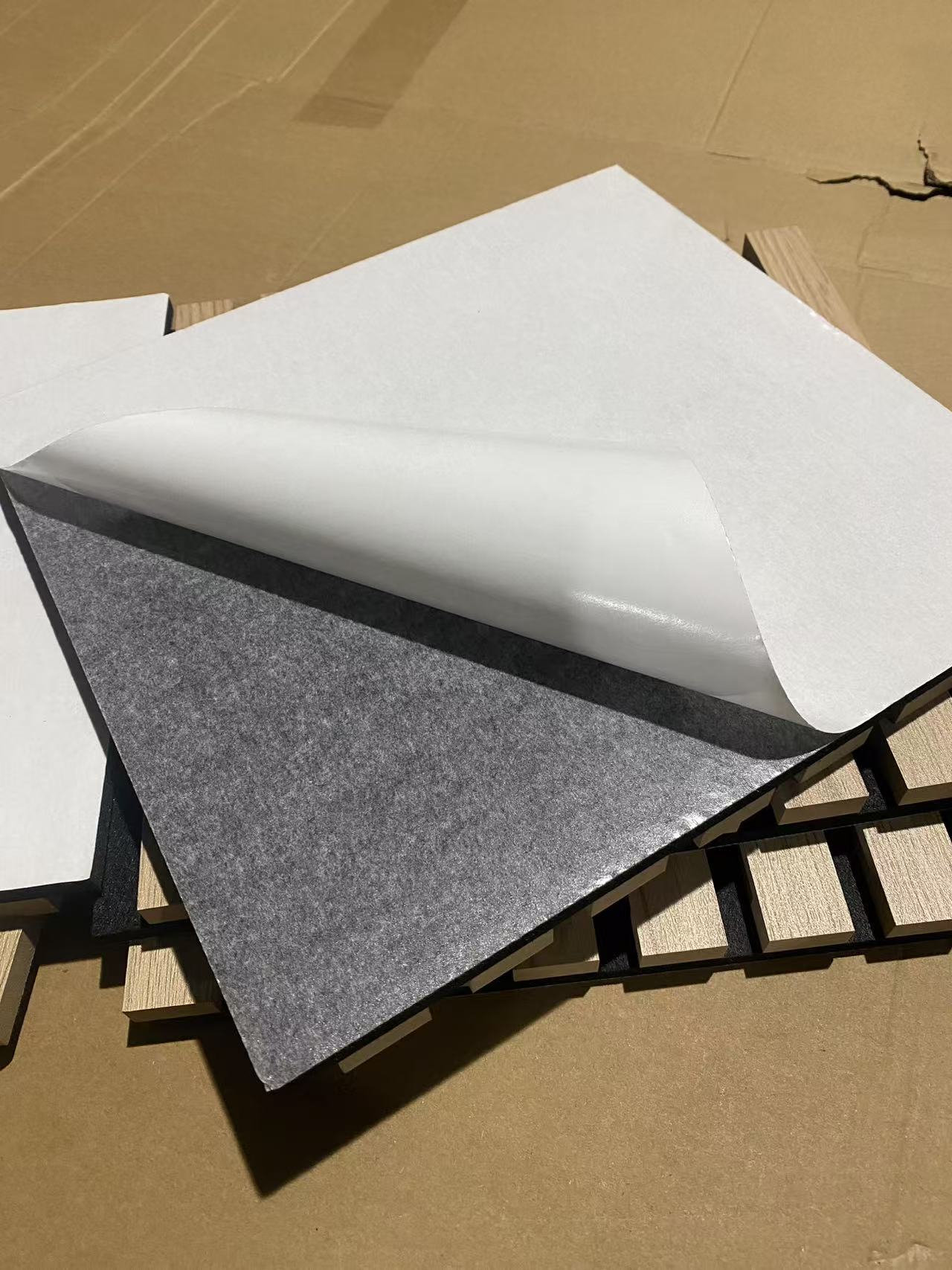Self-adhesive backing option